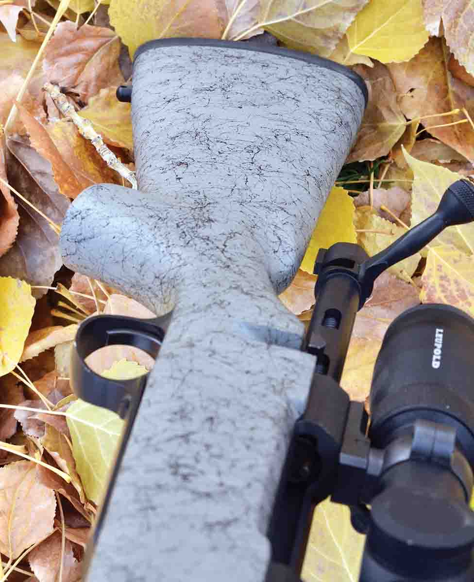 The negative comb actually slopes downward from the butt to obtain a  correct cheek weld, allows the bolt to clear the stock and helps to reduce muzzle rise.